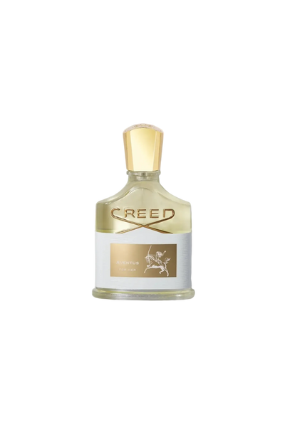 Creed perfume bottle with gold cap on a light gray background