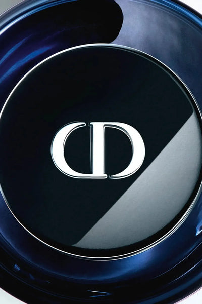 Close-up of a Dior sauvage elixir bottle with the brand logo.
