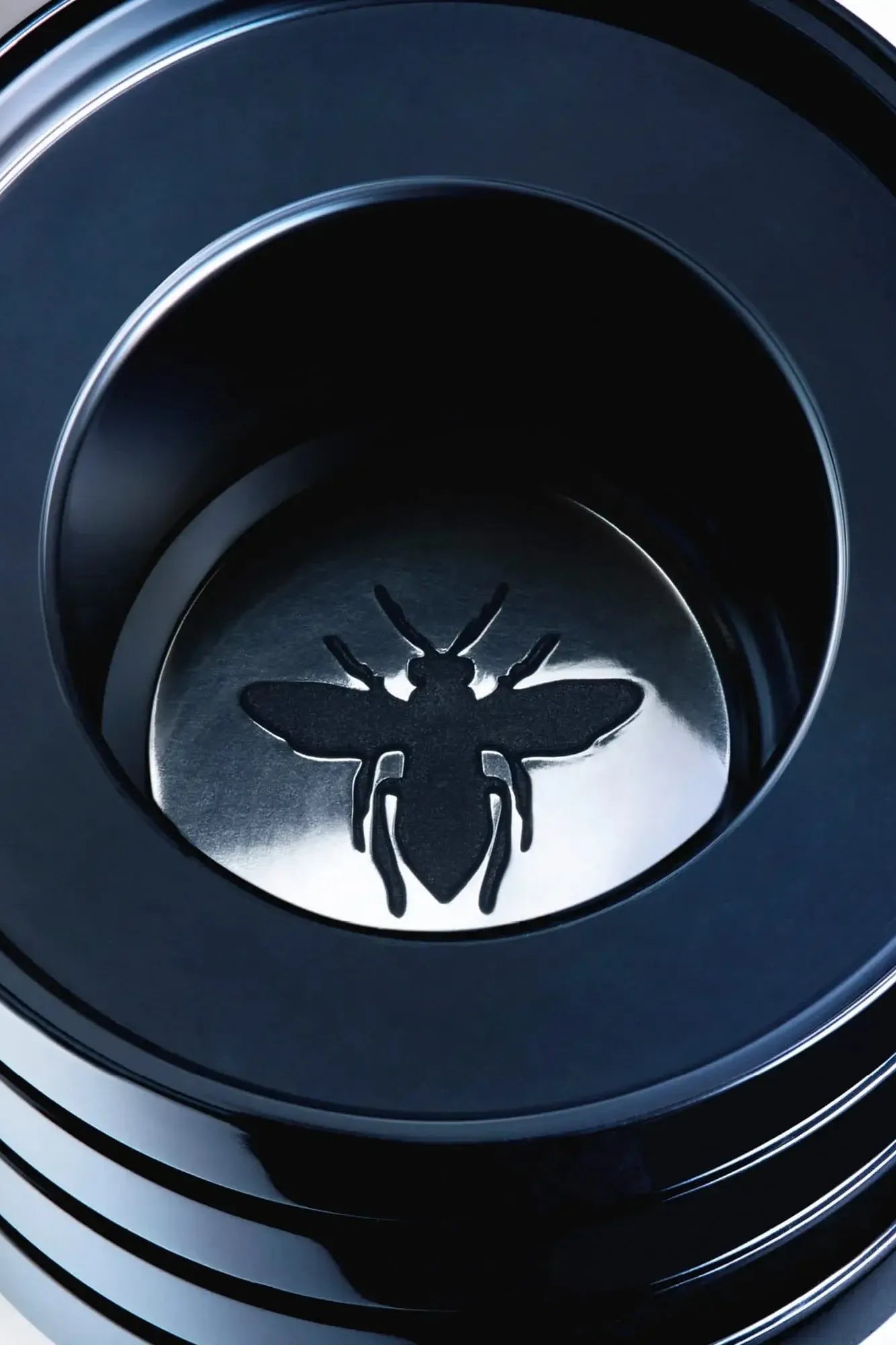 Dior sauvage elixir with a bee emblem